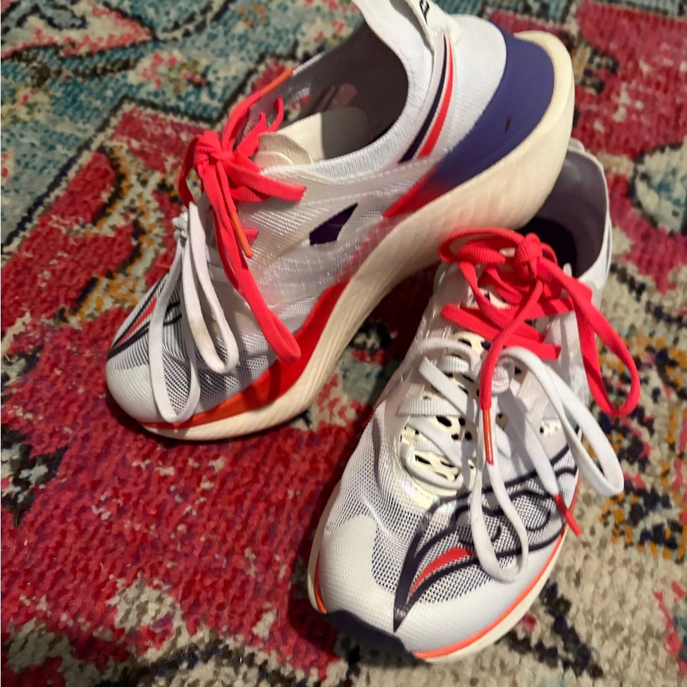 Saucony White Running Shoes with Pink Laces and Purple Heel Accents